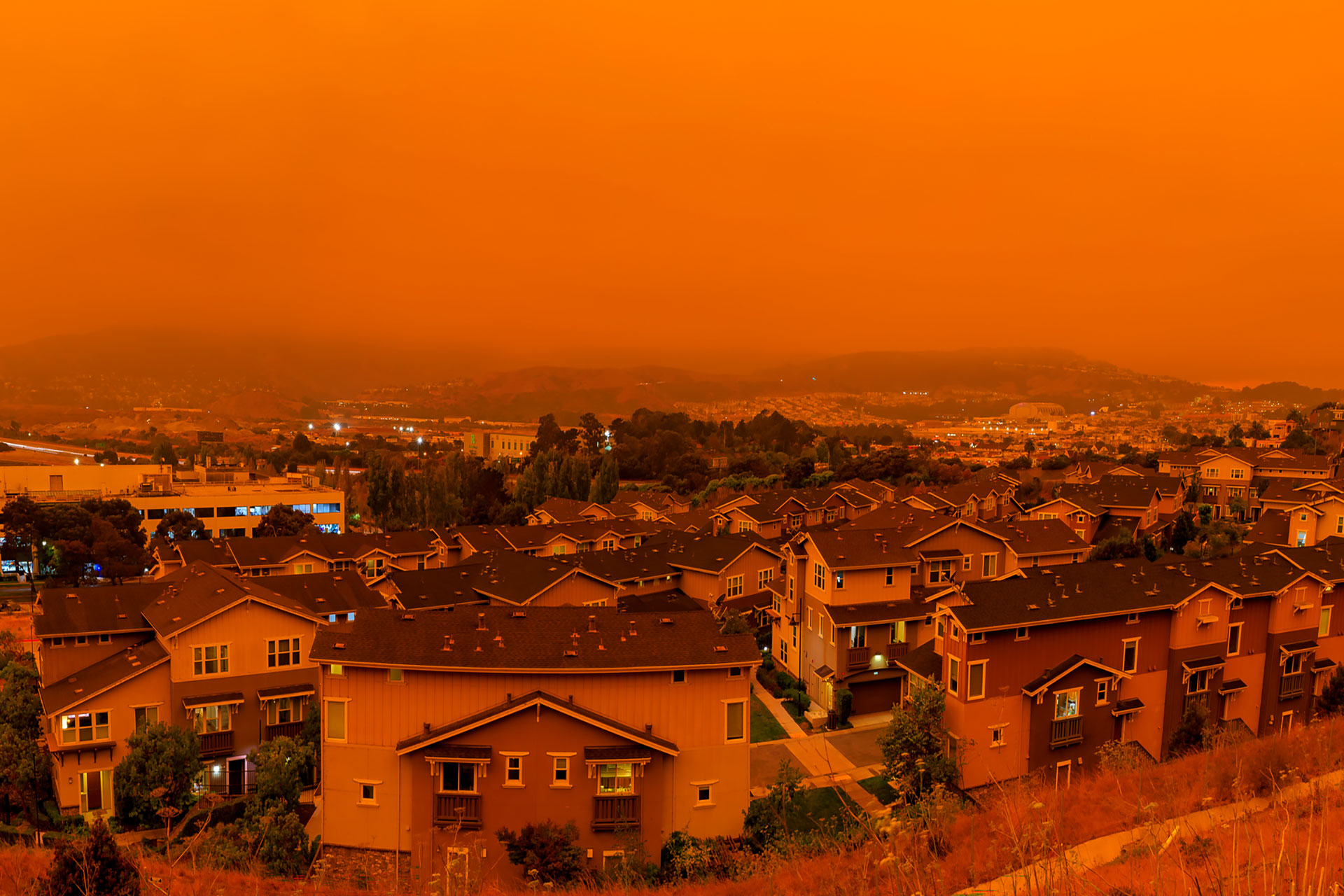 Thick orange haze above San Francisco on September 9, 2020 from record wildfires in California, daytime view of ash and smoke floating over the Bay Area