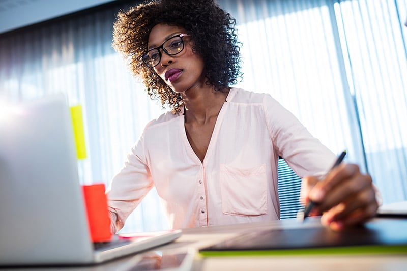 Woman drawing on a tablet