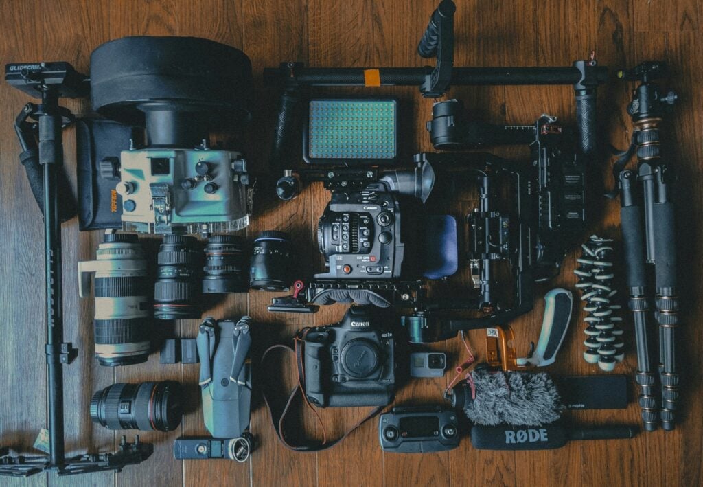 Various kinds of photography gear laid out on a table