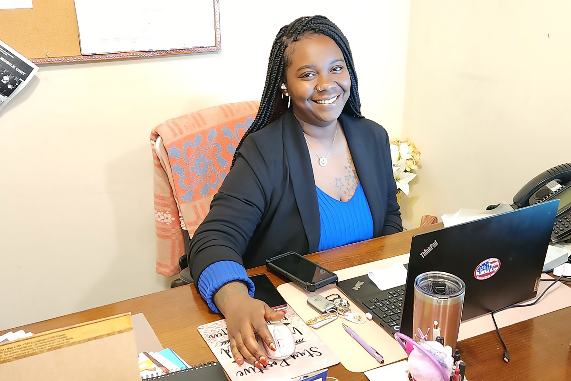 Shymeka Wright sits at her desk