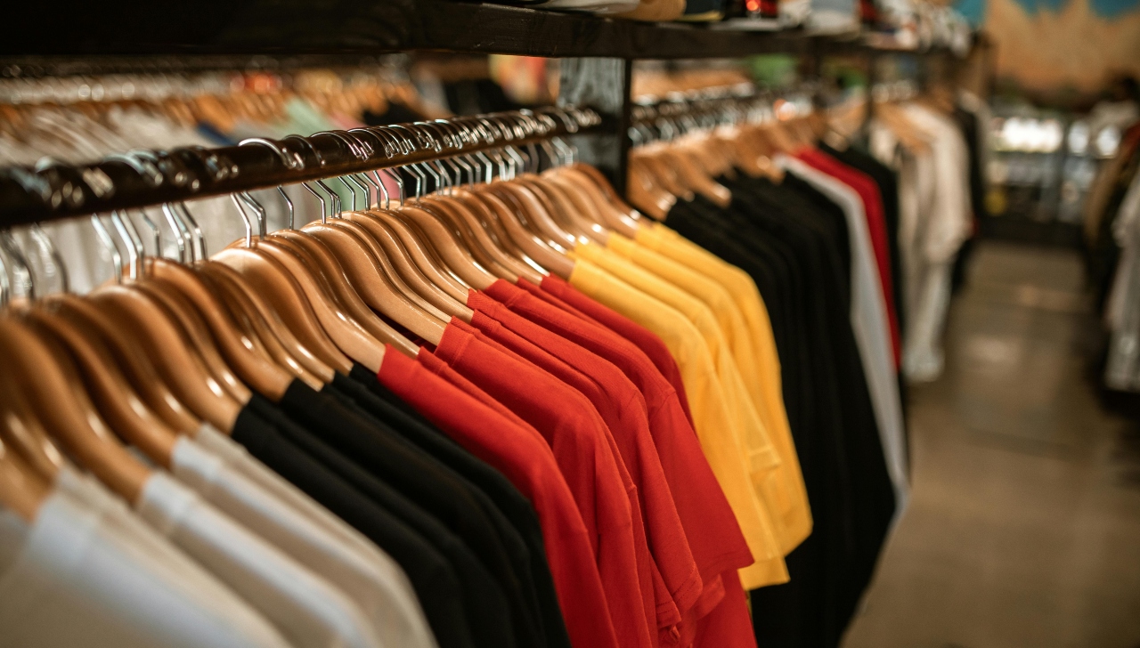 row of t shirts on a rack